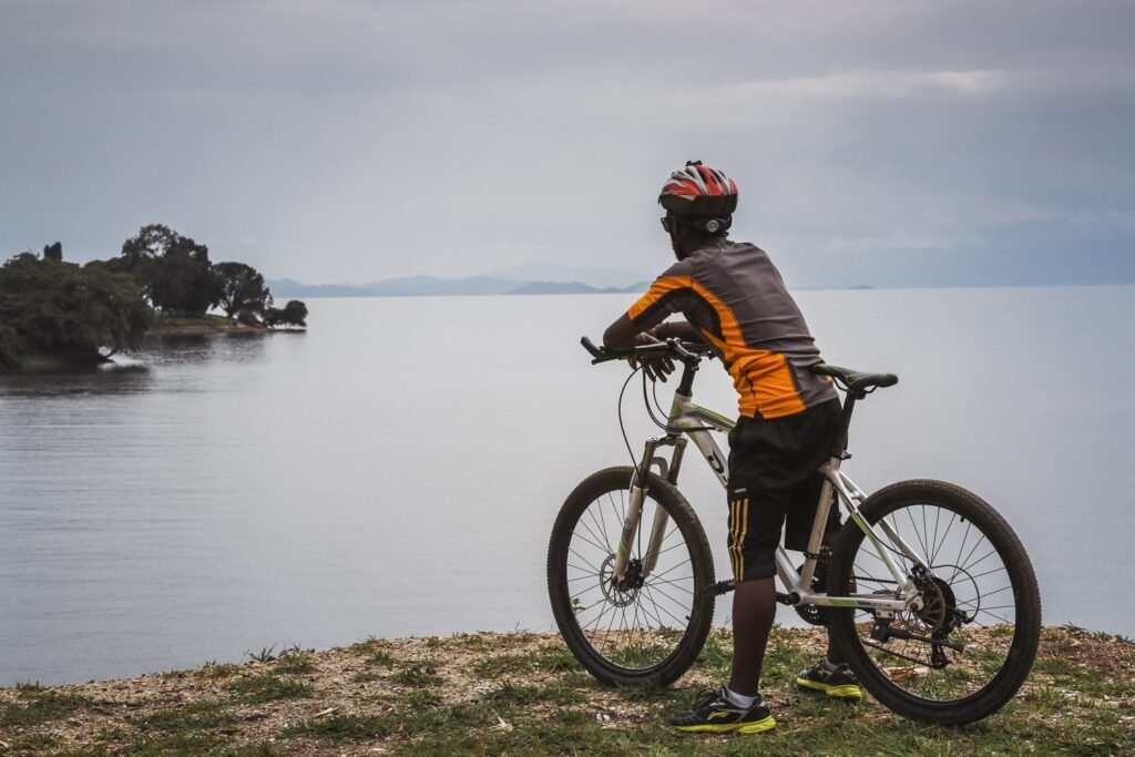 Among the most rewarding ways to discover the country is through Cycling Rwanda, an immersive adventure that connects visitors with scenic countryside roads, volcanic landscapes, lakeside views, forests, wildlife areas, and local communities.