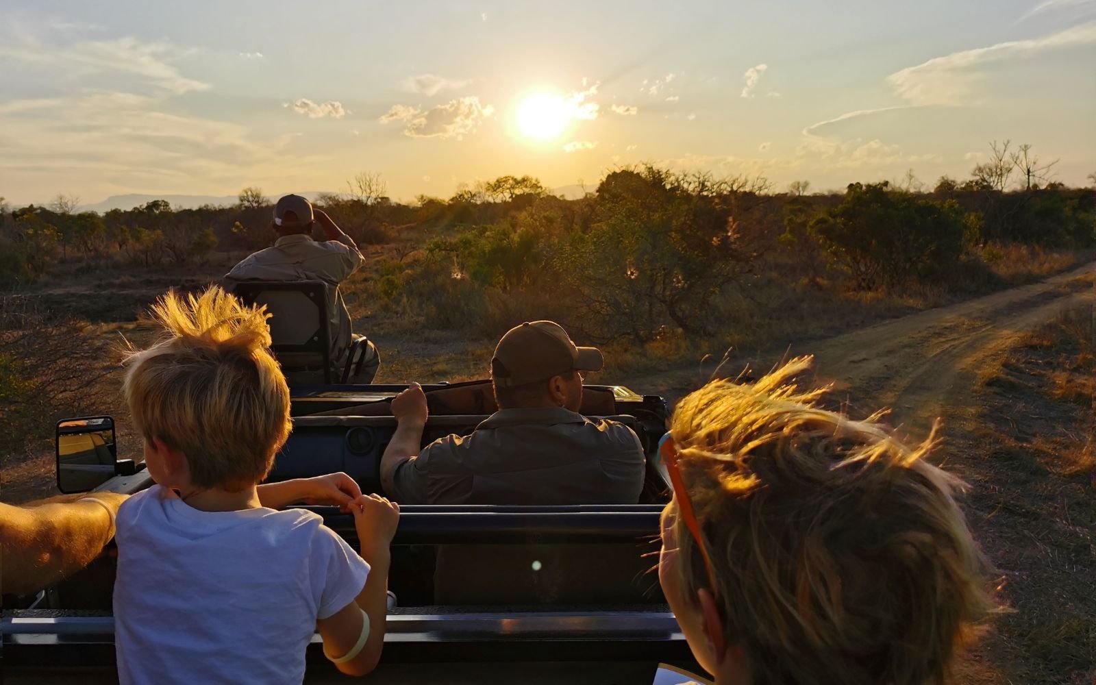 Kids enjoying a sunset game drive in Timbavati Game Reserve South Africa during a family wildlife safari